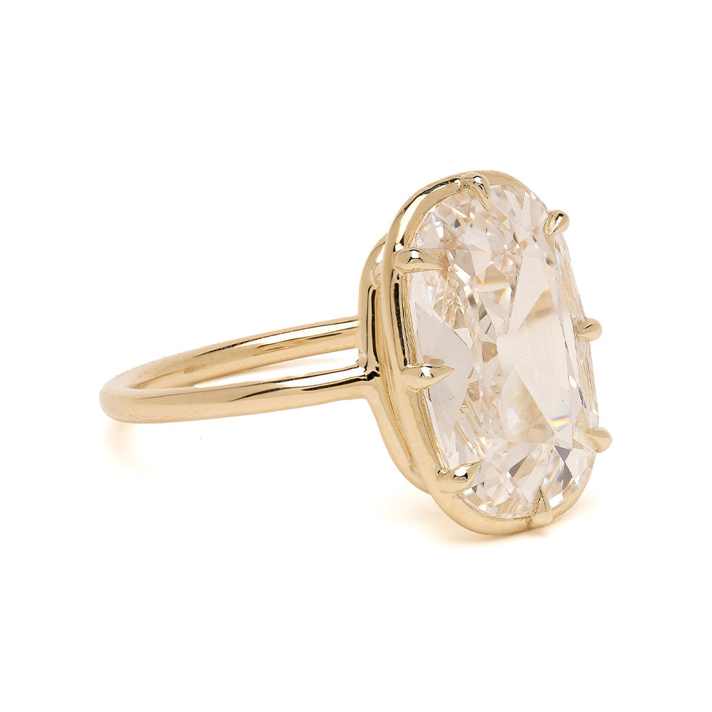 Gigi Sofia Kaman gold lab grown diamond ring with prong-set faceted center stone on display