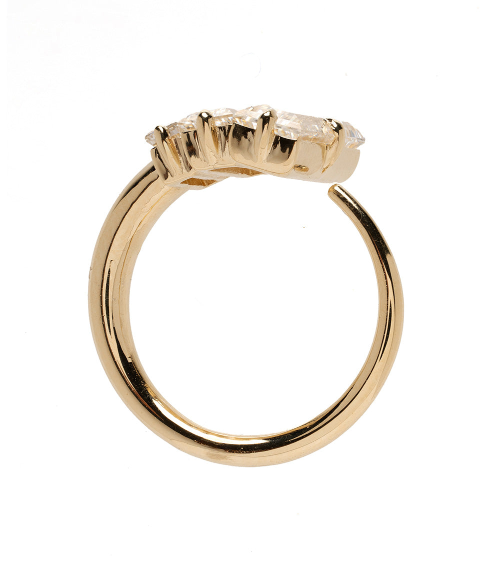 Gold ring with a diamond on a white background