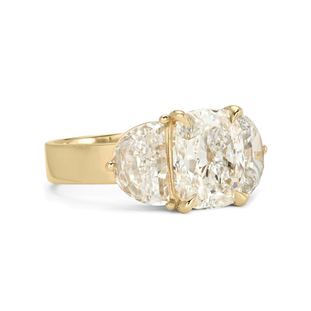 Charlie Sofia Kaman understated unique engagement ring in gold with oval-cut diamond setting