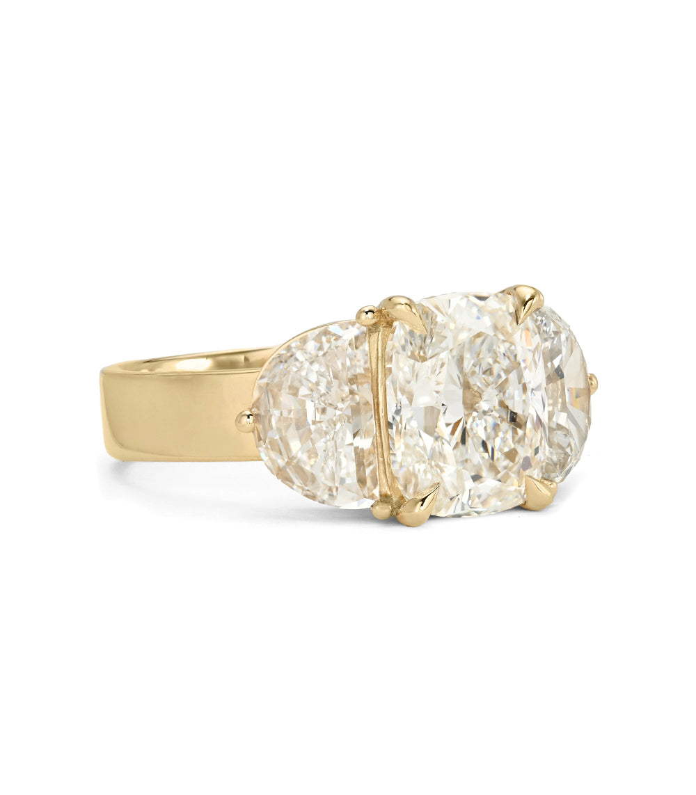Charlie Sofia Kaman understated unique engagement ring in gold with oval-cut diamond setting