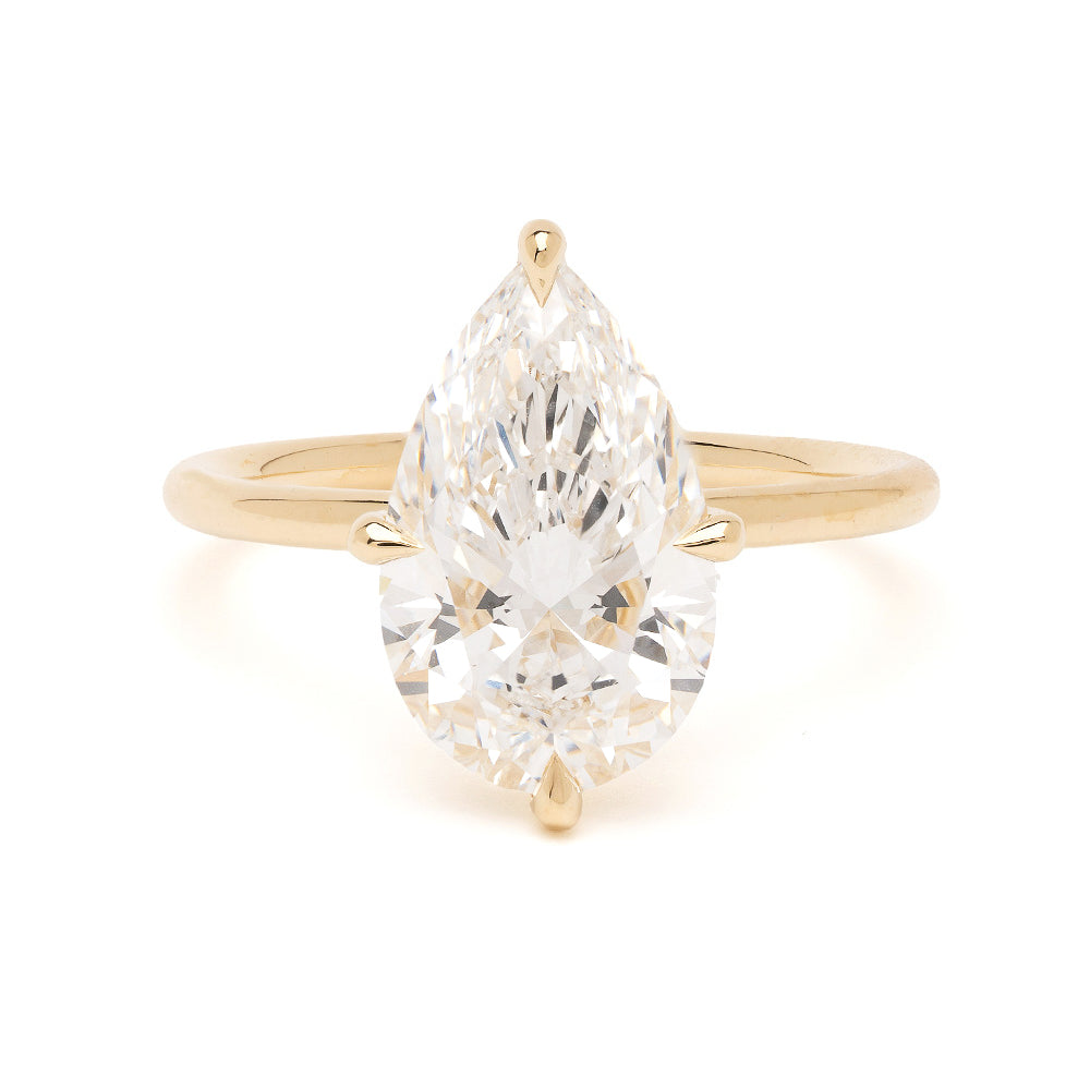 Annika by Sofia Kaman unique engagement ring in gold with understated pear-cut diamond sparkle