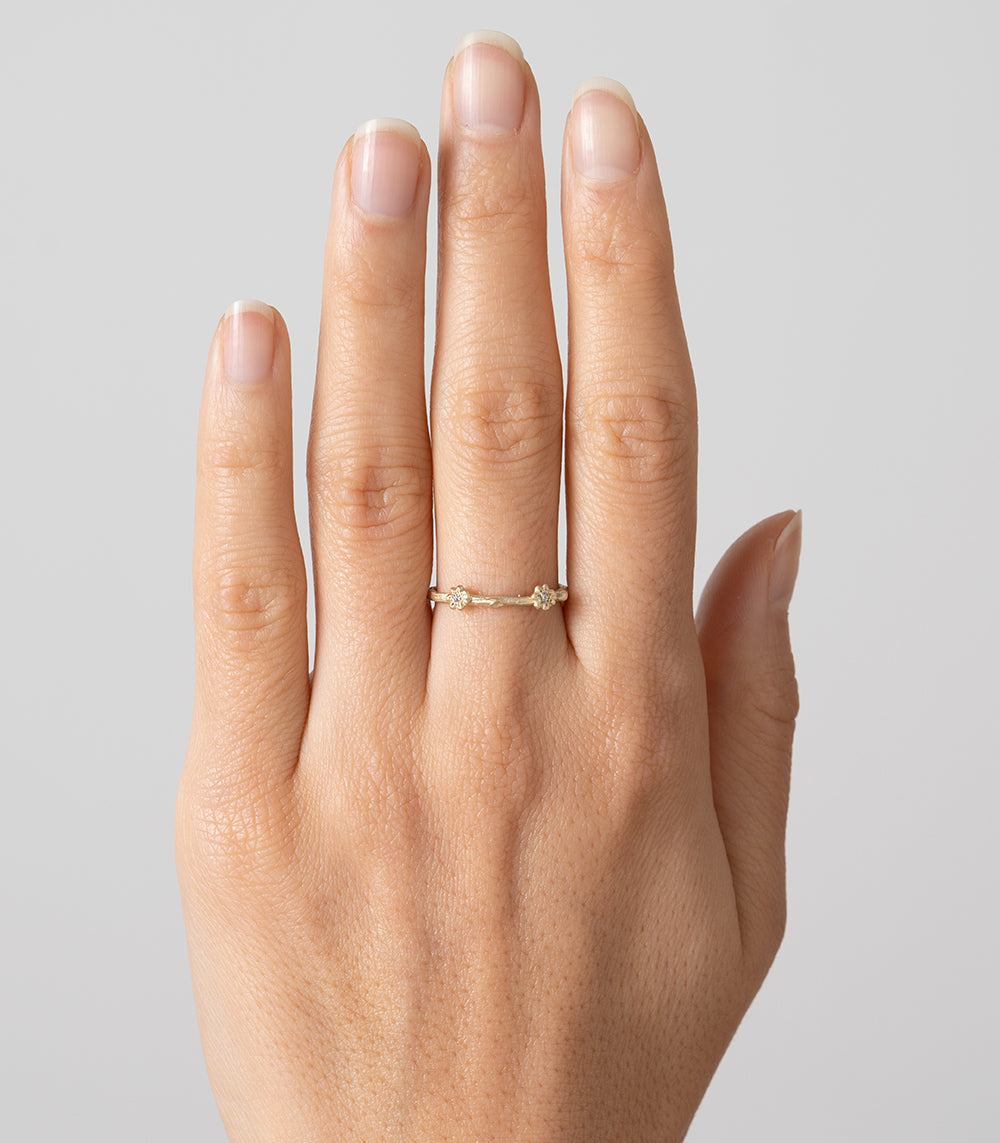 Twig Band ES-R3 14K yellow gold shiny twig band ring with small diamond accents on finger