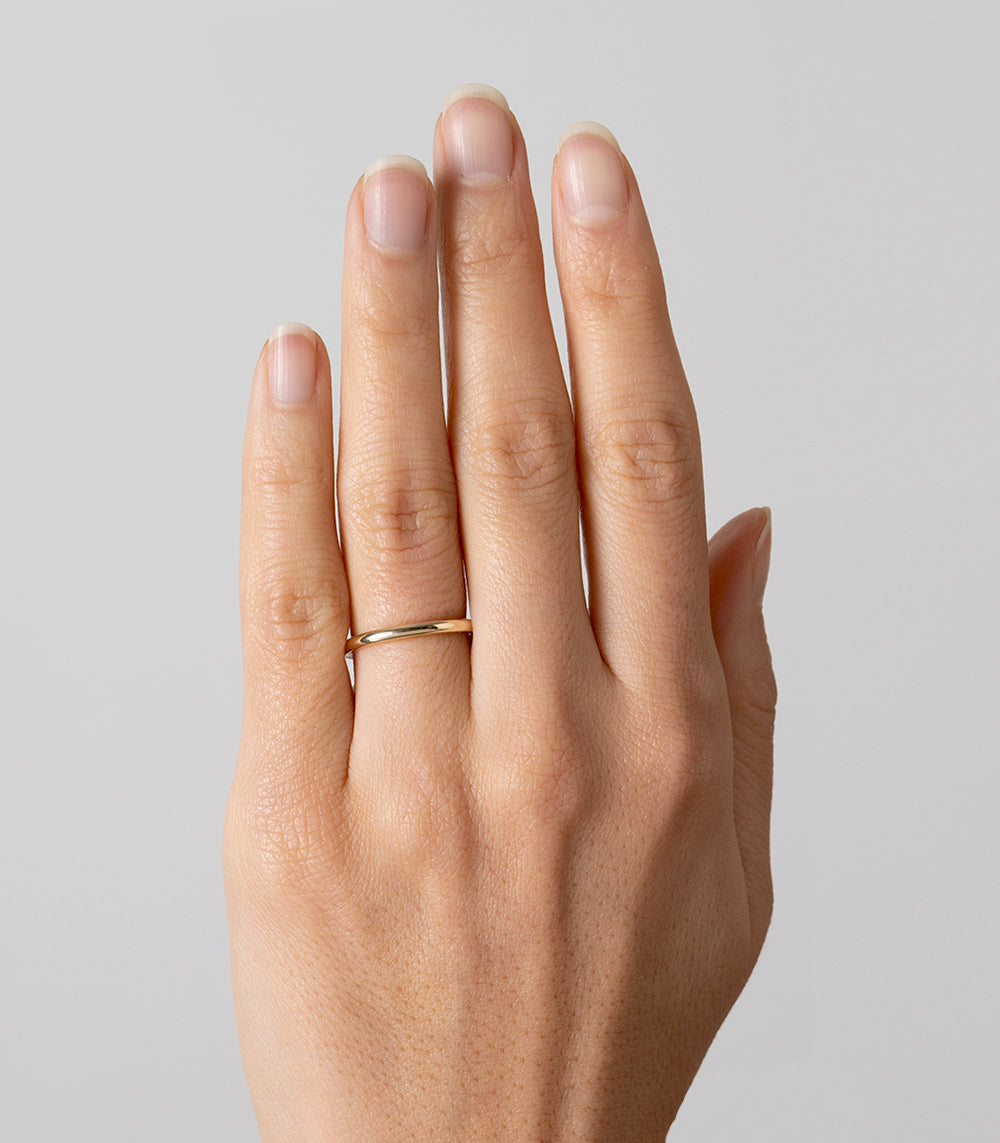 Smooth Round Band by A-R32 bands in 14K yellow gold, shiny smooth ring worn on finger
