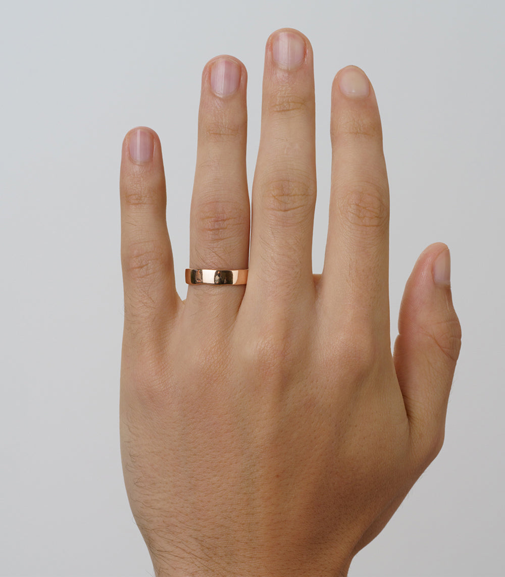 Torn Paper Wedding Band by M-R4-5 in 14K rose gold, shiny torn-paper edge design on hand