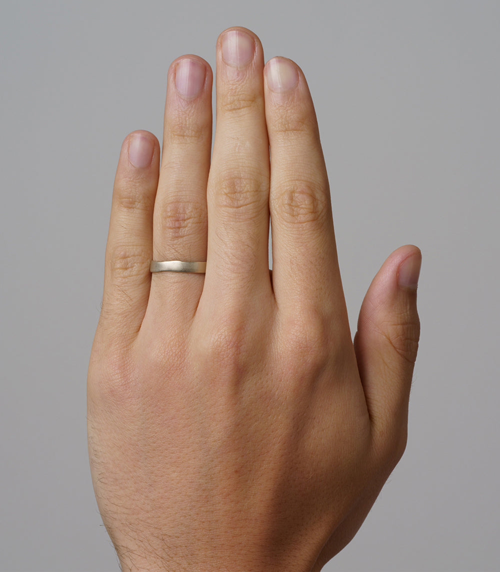 Torn Paper Wedding Band by M-R4-4 matte 14K white gold men’s wedding band on hand