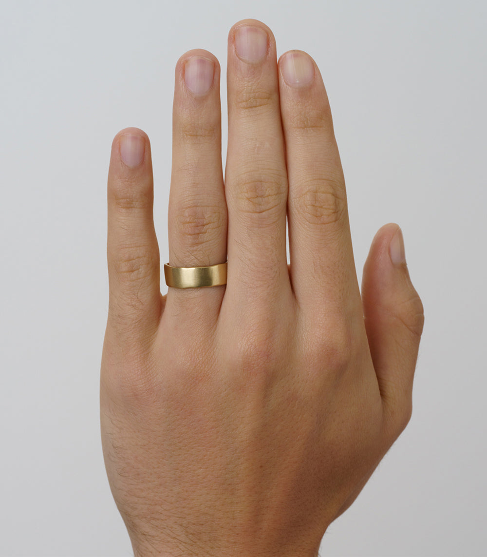 Torn Paper Wedding Band by M-R4-7, 14K yellow gold shiny wedding band on finger