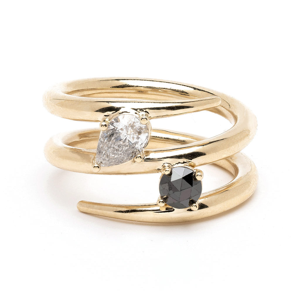 Triple Coiled Band by A-R42 in gold tone with clear oval diamond and black stone, triple stacked coils