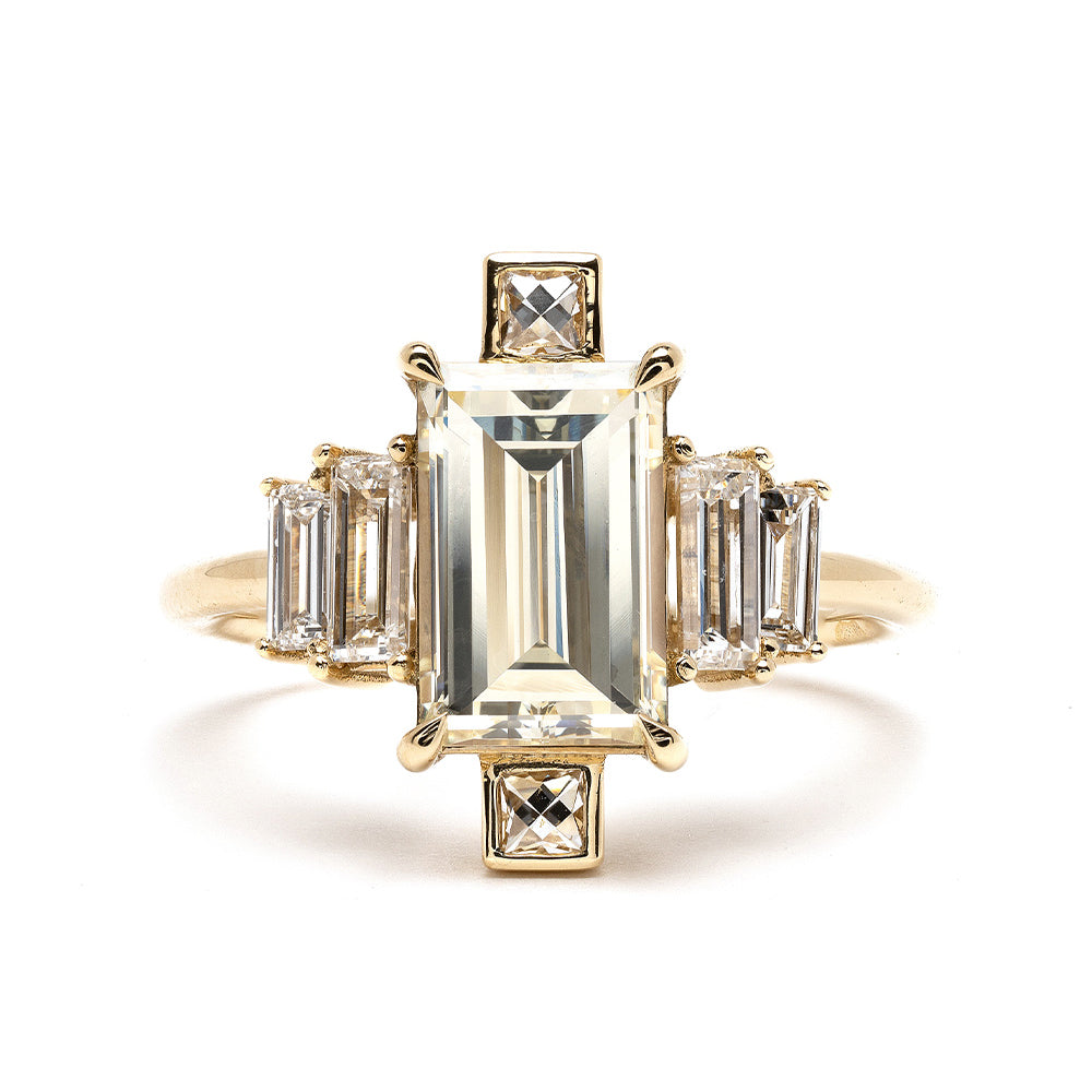 Xena by SK-R90 engagement ring in yellow gold with emerald-cut center and baguette side stones