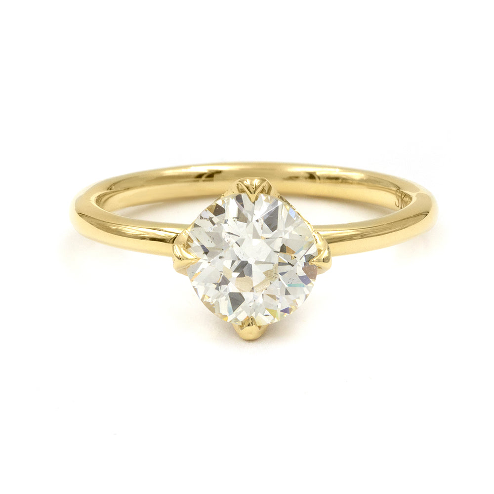Spiky Crown EL-R18-OEC-WD-MD understated gold engagement ring with single pear-cut diamond on plain band