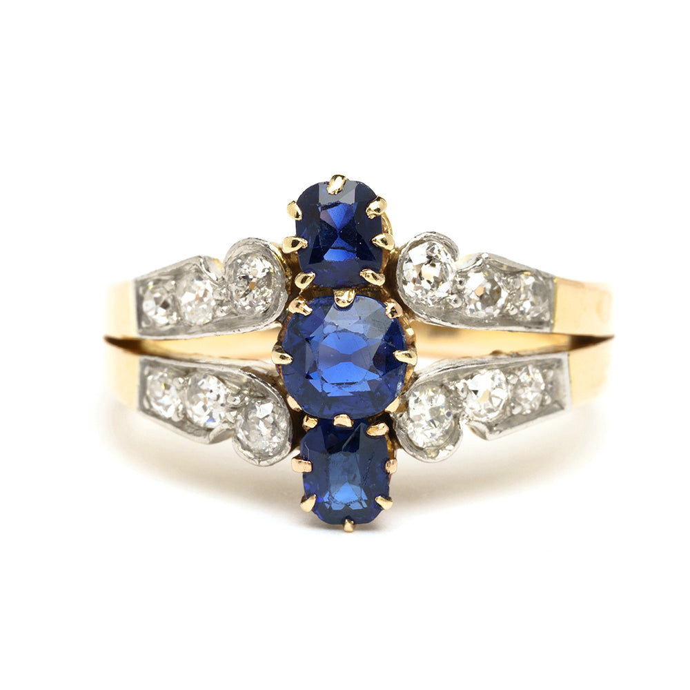 We May Be Royal VC-R177 ring in gold with oval blue center stones and clear side stones