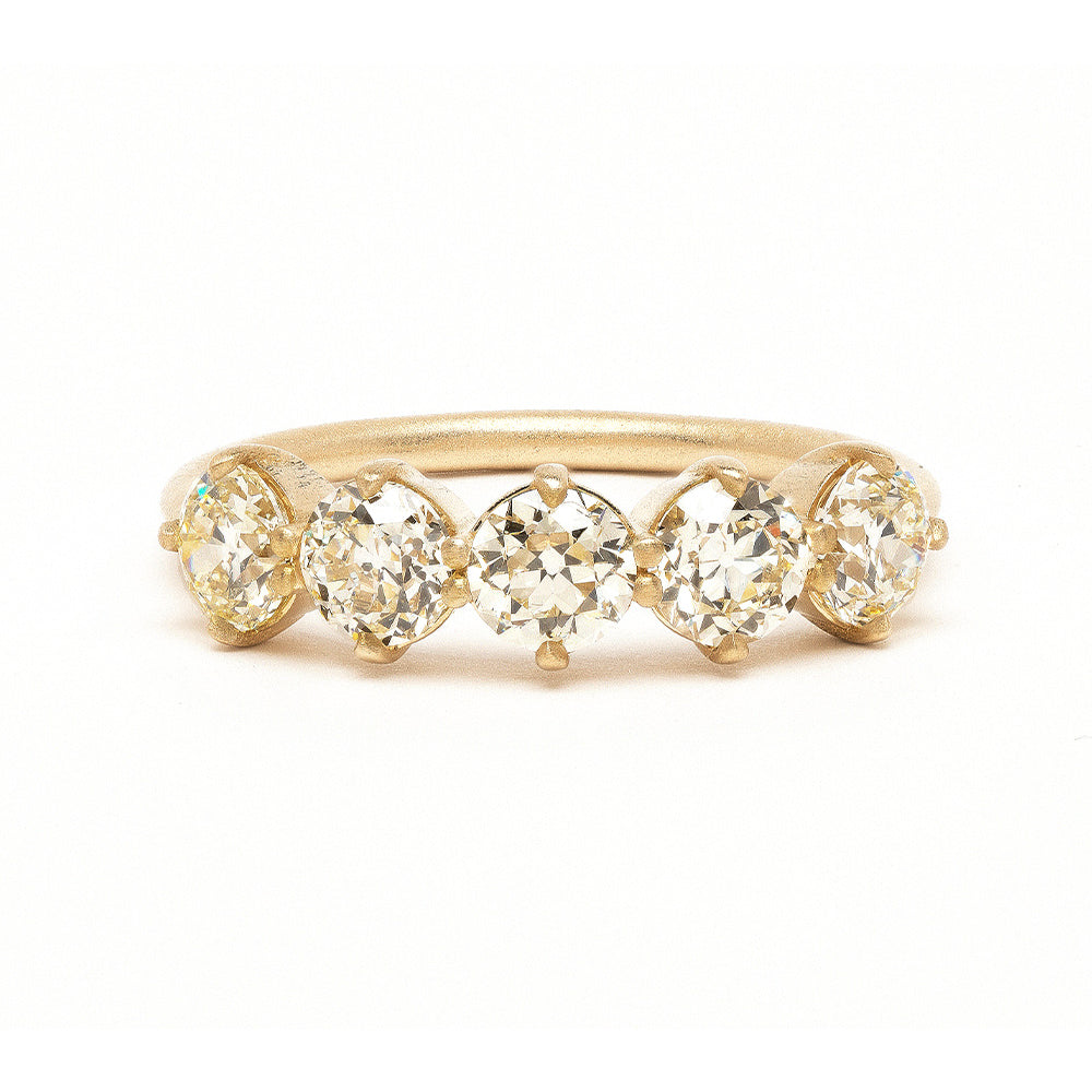 Claudette 5 Stone Band SK-R68-Band-1.68 gold band with five clear stones, prong-set profile.