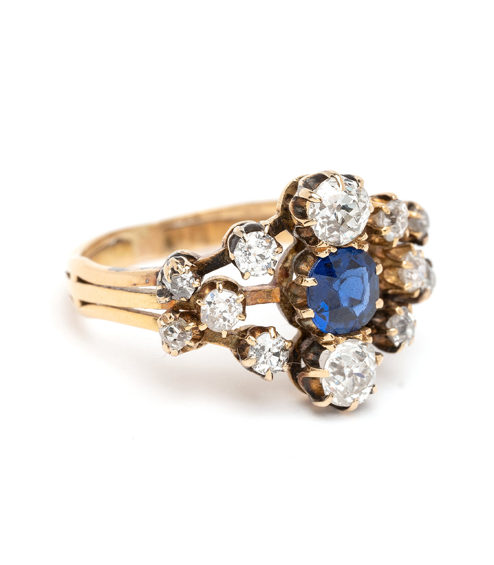 Anastasia VC-R168 vintage gold ring with clear cluster stones and a deep blue center—ornate setting.