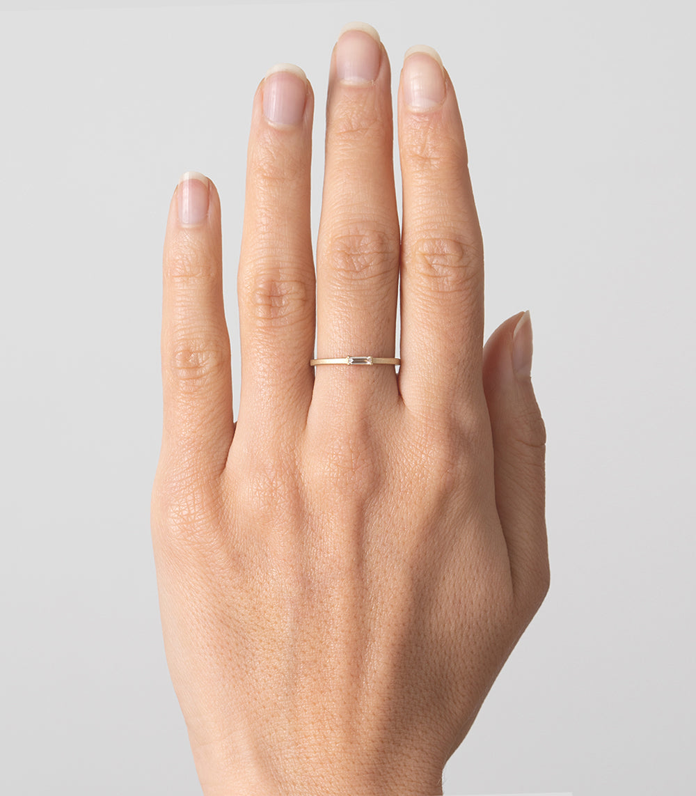 Stardust by SK-R78 14K yellow gold ring band with a small central diamond, shiny finish