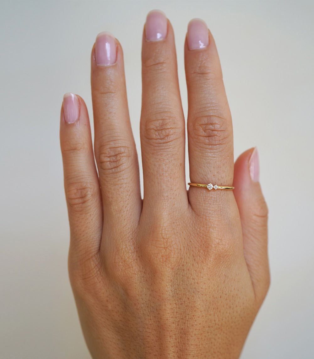 Confetti Band SB-R5 yellow gold ring with shiny finish and small diamond accents on hand