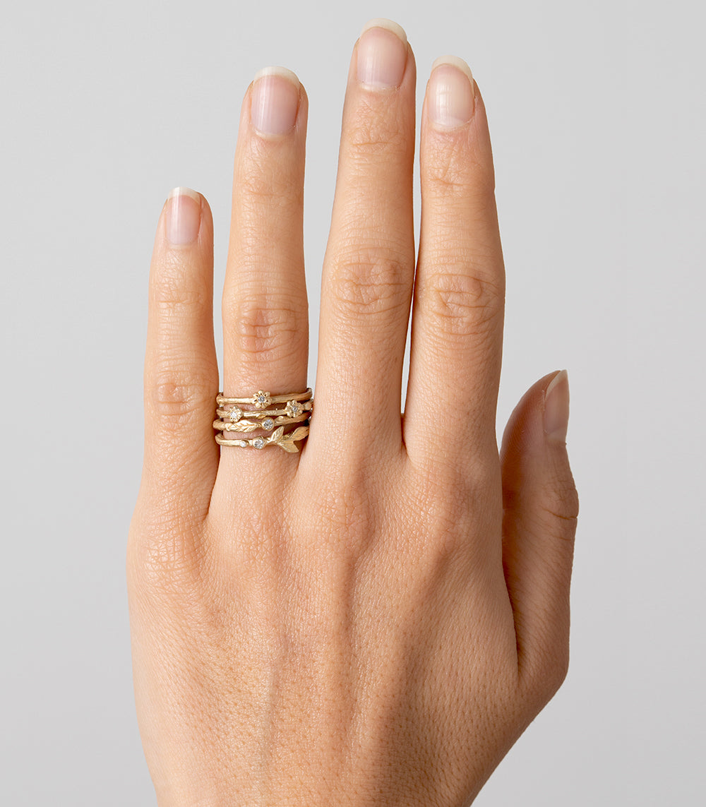 Twig Band ES-R2 ring in shiny 14K yellow gold with delicate twig-like stacked diamond bands