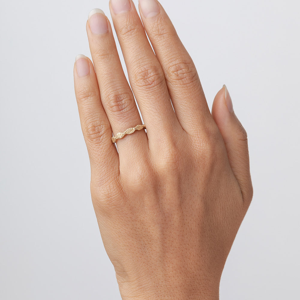 Layered Leaves ES-R25 ring in shiny yellow gold with layered leaf band detail on hand