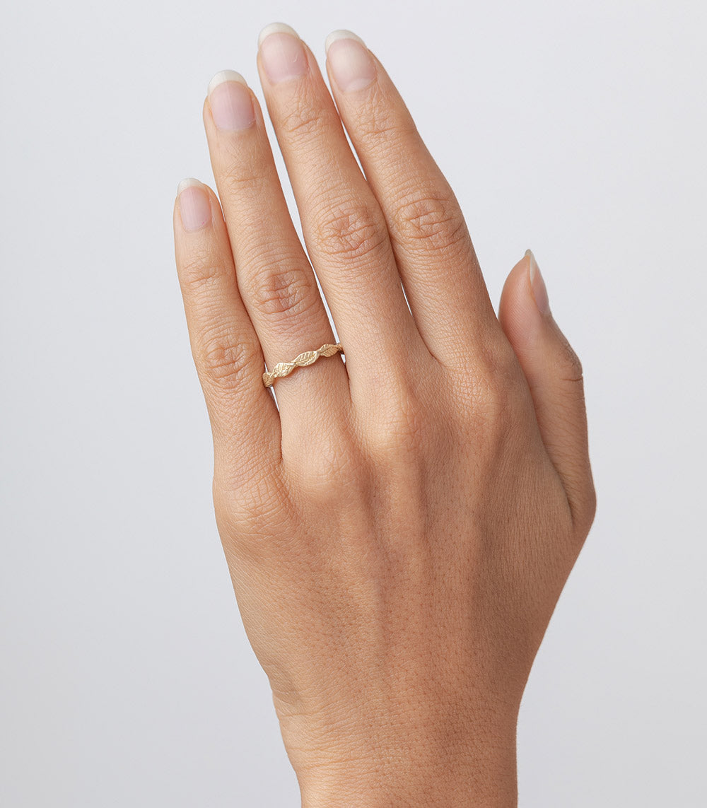 Layered Leaves ES-R25 ring in shiny yellow gold with layered leaf band detail on hand