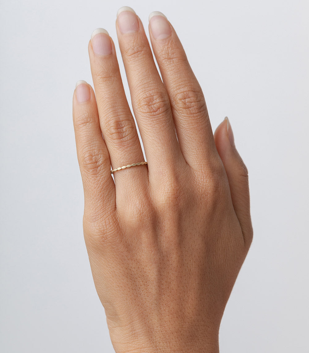 Petite Marquise AL-R11 understated 14K yellow gold band on hand with slim shiny finish