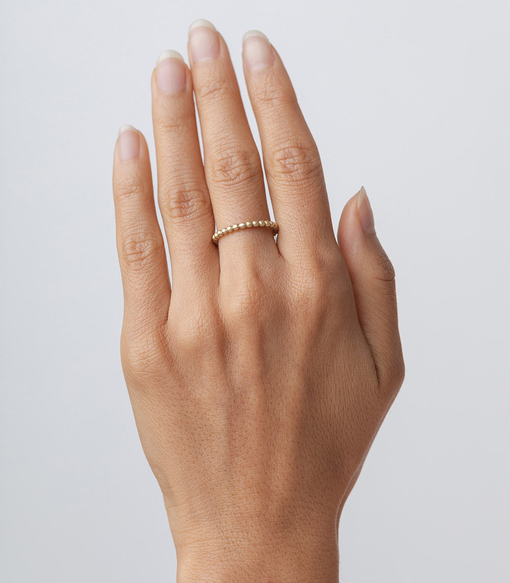 Bubble Band—understated R-R11 ring in 14K yellow gold, shiny bubble texture for stacking