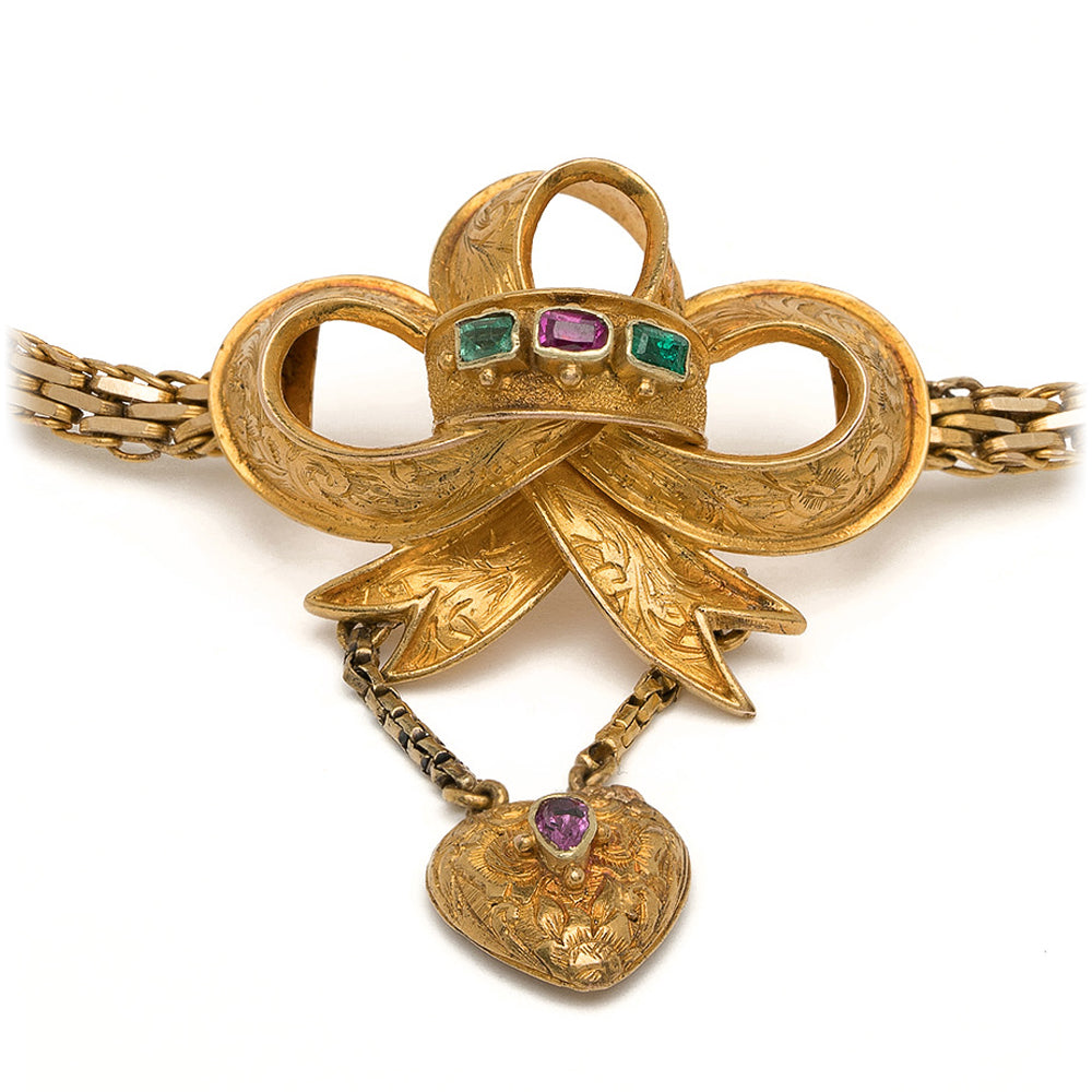 Spellbound Bow Bracelet VC-B11 gold-tone bracelet with ornate bow and faceted green and purple stones
