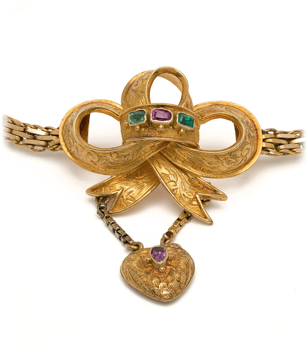 Spellbound Bow Bracelet VC-B11 gold-tone bracelet with ornate bow and faceted green and purple stones