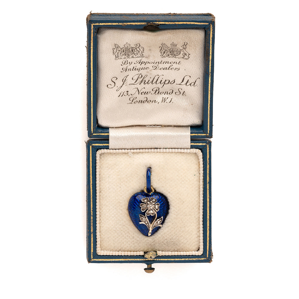 True Blue VC-N68 heart pendant in vivid blue enamel with small gold-tone flower detail in display box
