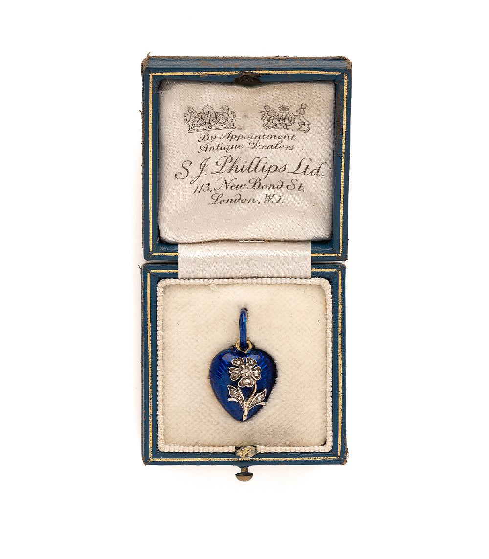True Blue VC-N68 heart pendant in vivid blue enamel with small gold-tone flower detail in display box