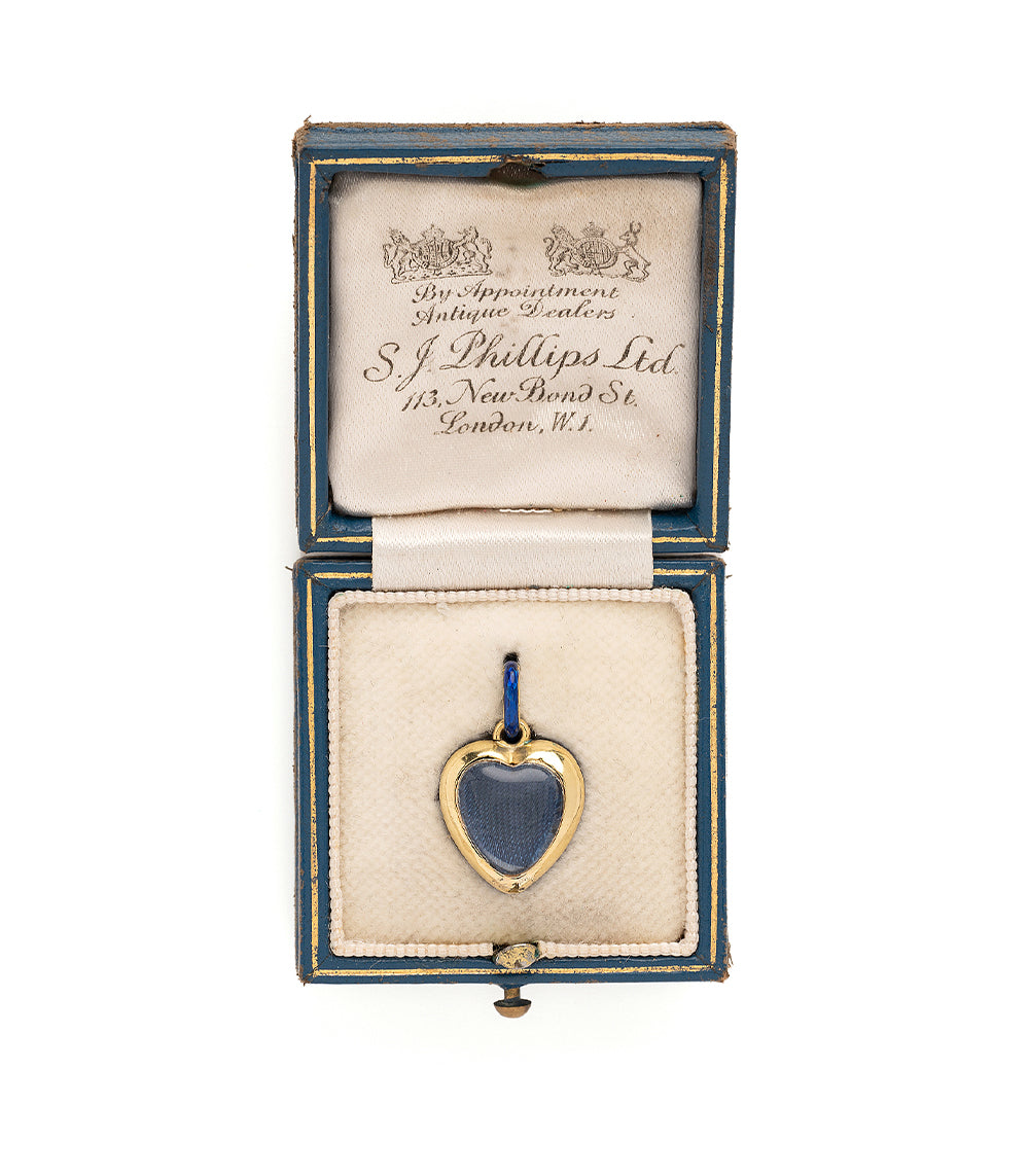 True Blue VC-N68 gold heart charm with blue enamel in a hinged presentation box, vintage style.