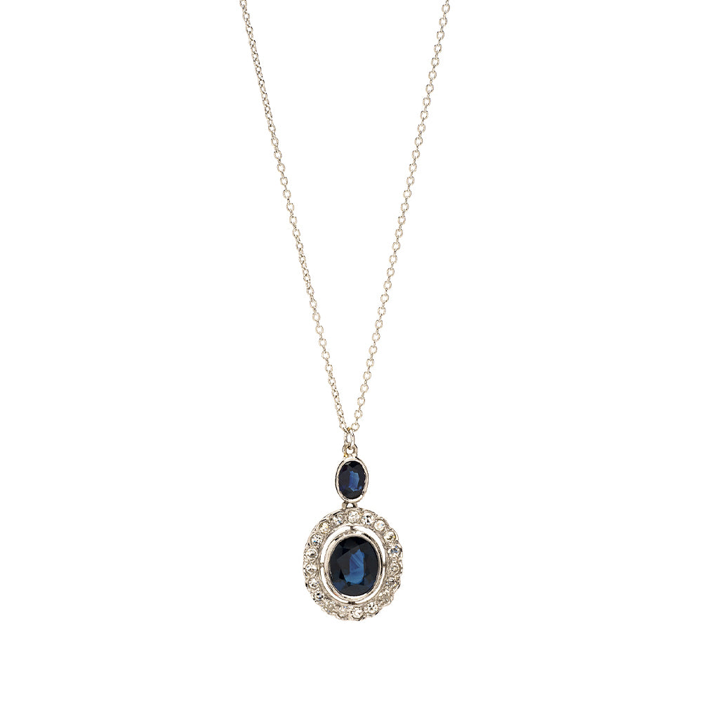 Timeless Elegance VC-N66 gold necklace with dark blue oval gemstone halo pendant, understated vintage style