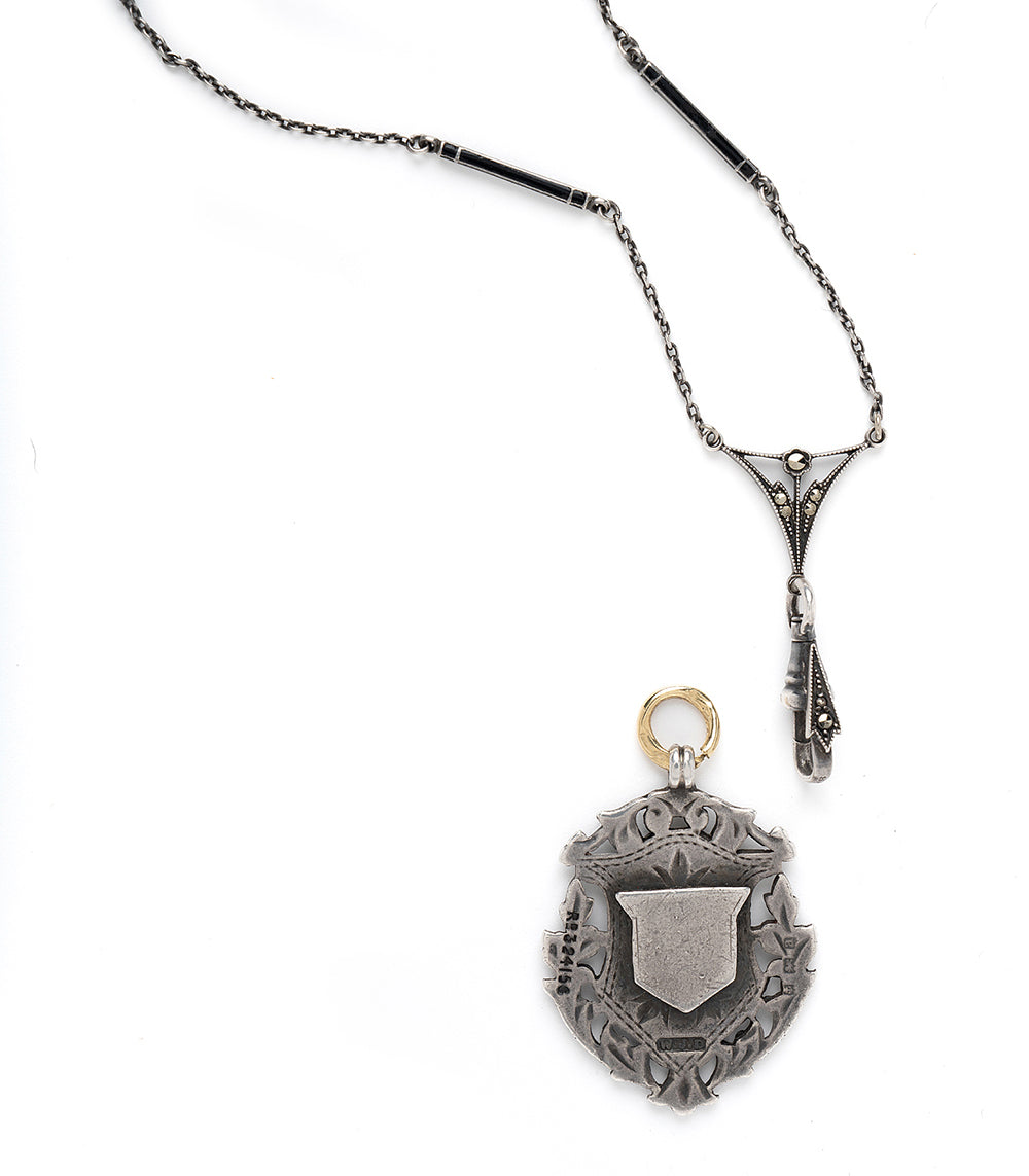 Midnight in Paris VC-C4 silver necklace with black detailing and a small gold ring charm on chain