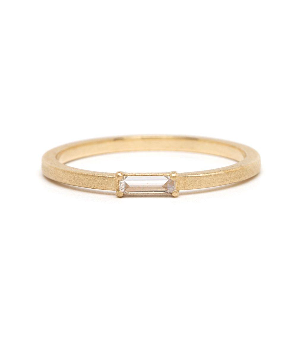 Stardust SK-R78 14K yellow gold band with rectangular-cut center stone on a slender shank