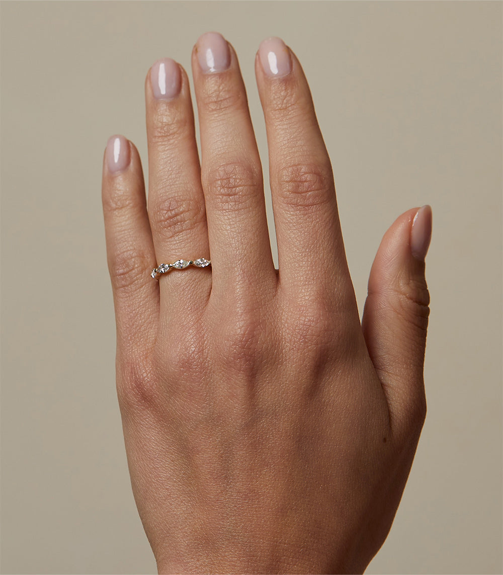 Kissing Diamonds EB-R16 unique engagement ring in white gold with understated shiny pave stones on finger