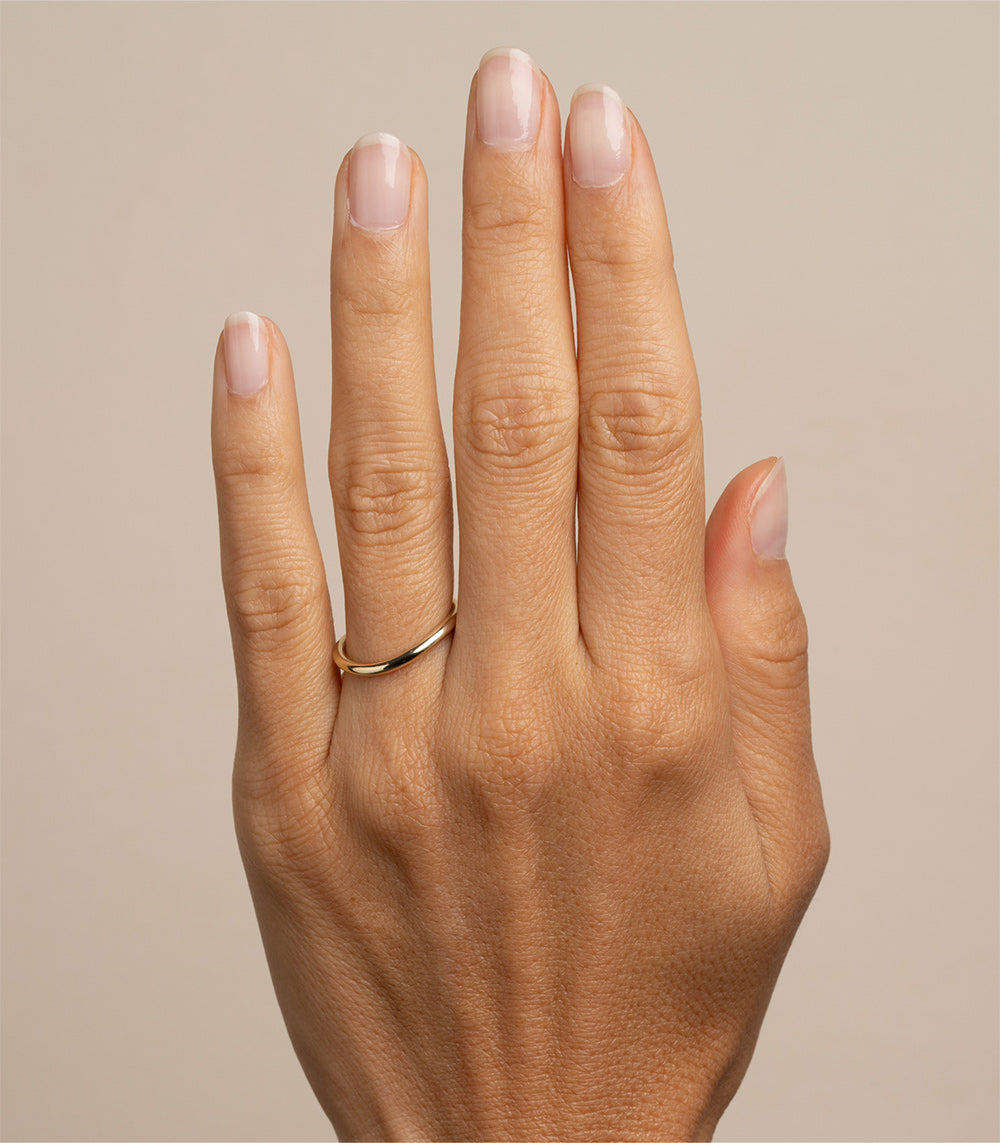 Mini Melt by EGB-R18 slim shiny 14K rose gold band ring with a slender profile, worn on a hand