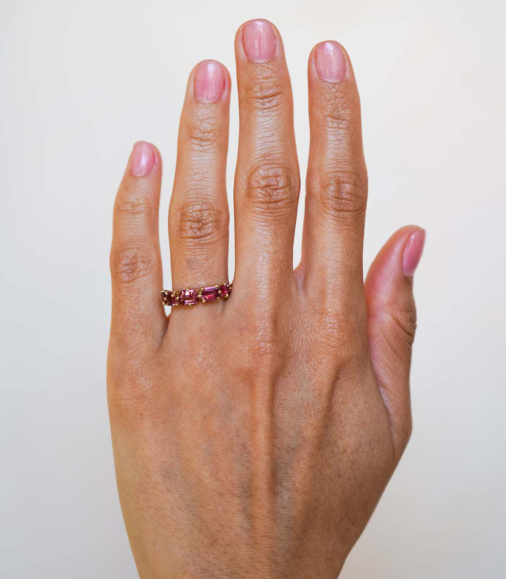 Claudette 5 Stone Band by SK-R68B-5-MC-PS-1.64 five-stone ring in rose-pink gemstones on a hand