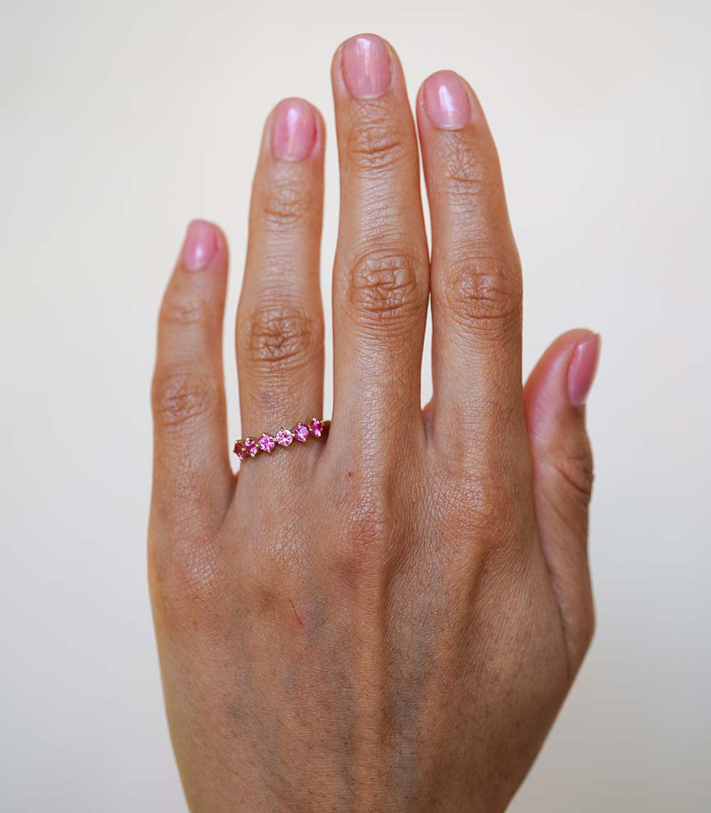 Claudette Gemstone Stacking Band SK-R68B-6-RB-PS-0.69 pink gemstone band on hand, close-up.