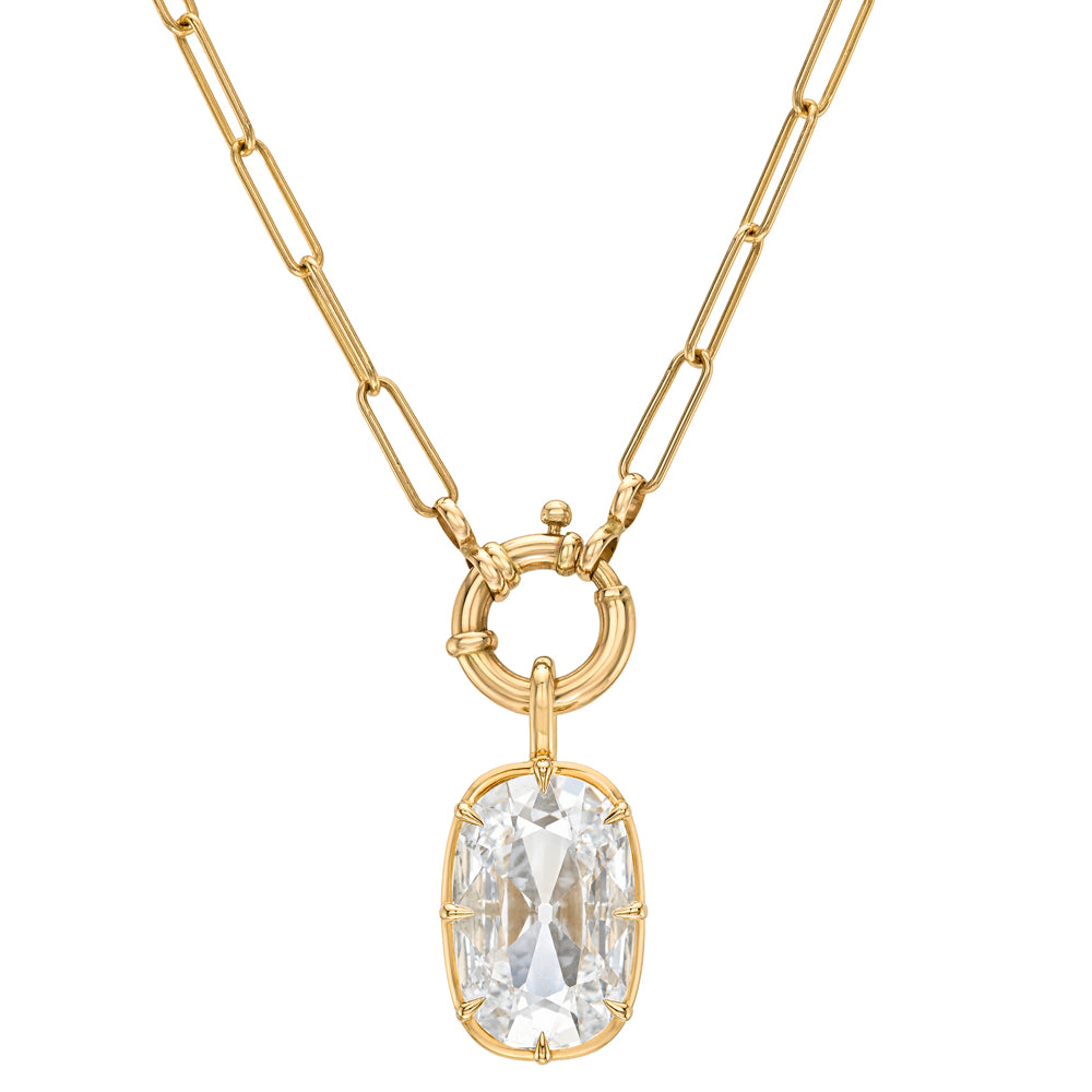 A gold paperclip chain necklace with a circular ring clasp holding a lab grown diamond cushion cut pendant, shown on a plain white background.