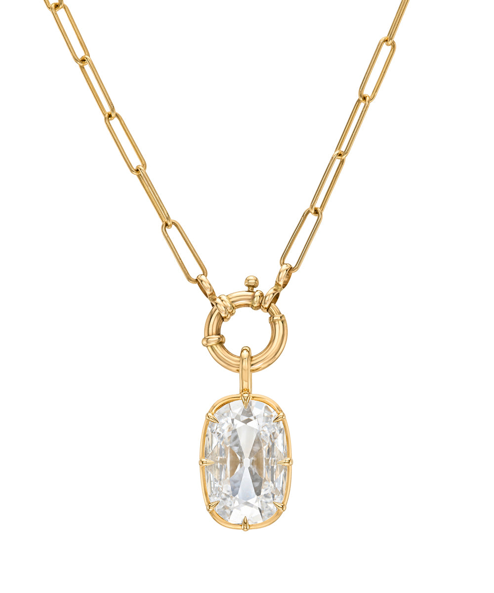 A gold paperclip chain necklace with a circular ring clasp holding a lab grown diamond cushion cut pendant, shown on a plain white background.